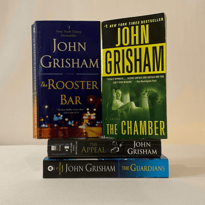 Covers of John Grisham books, #1 New York Times Bestseller.