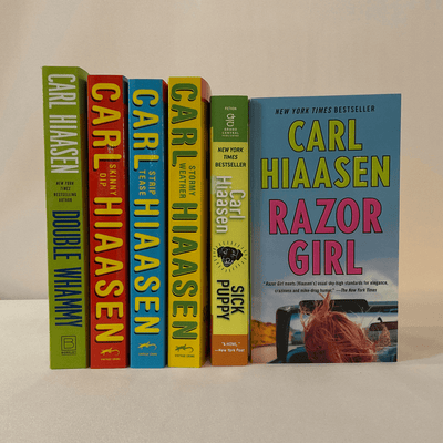 Covers of Carl Hiaasen novels.