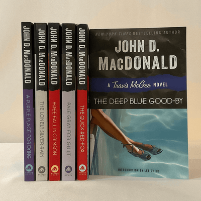 Cover of "The Travis McGee" series by John D. MacDonald.